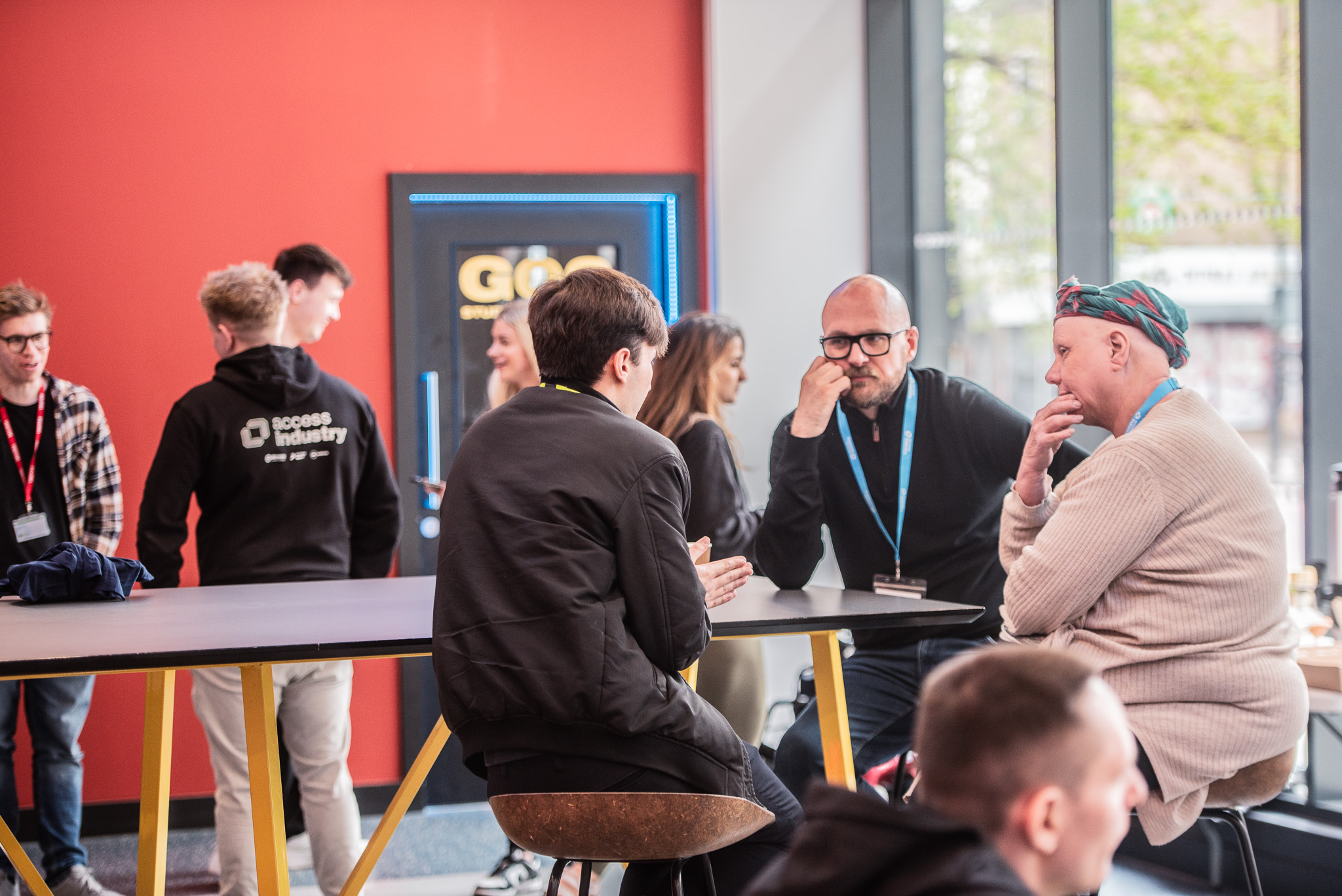 Two employers speaking to a candidate at an apprenticeship networking event (Access Industry).