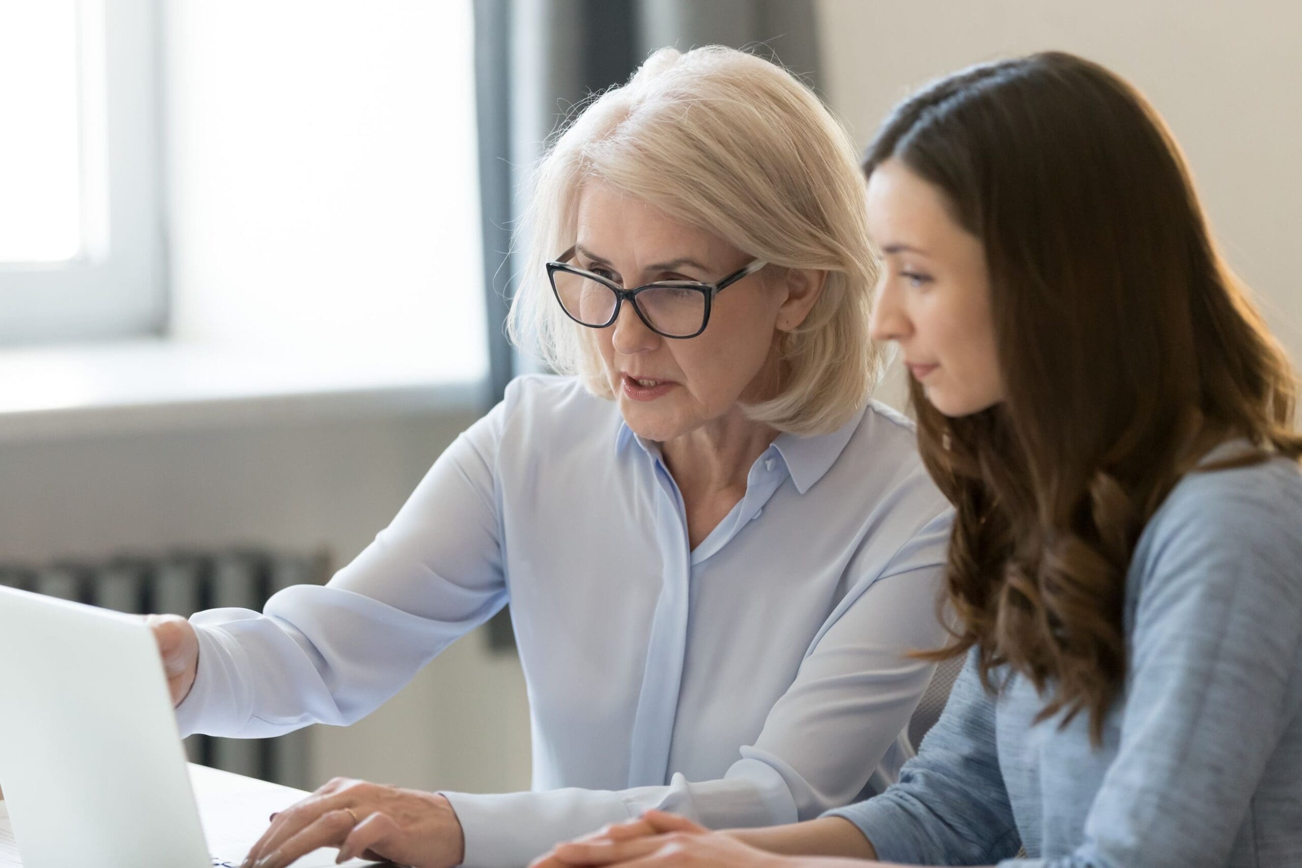 Employer mentoring her employee