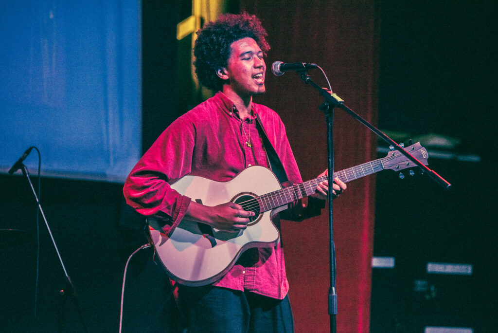 ACC Student playing guitar