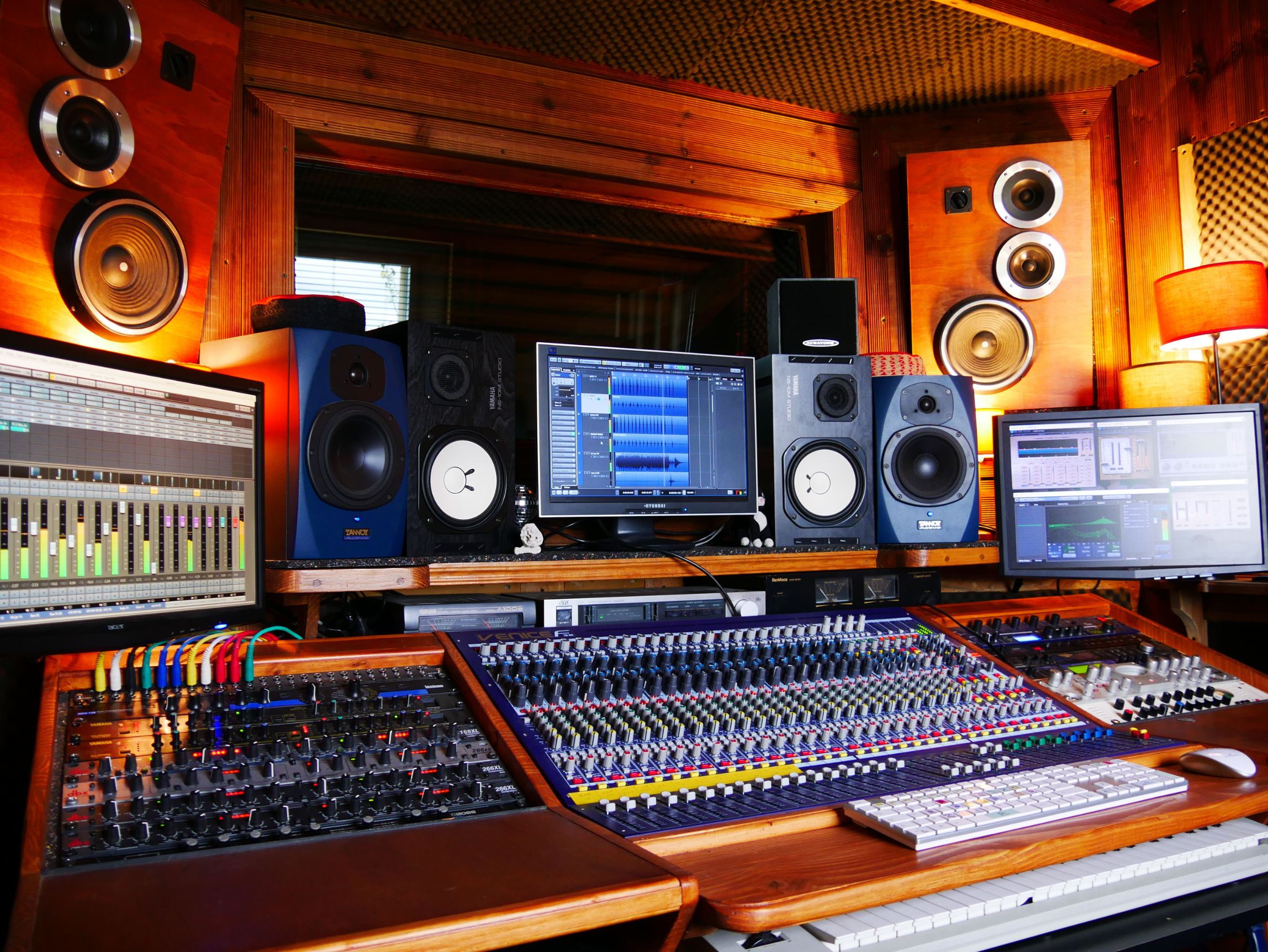 Record label recording studio with mixing console and speakers