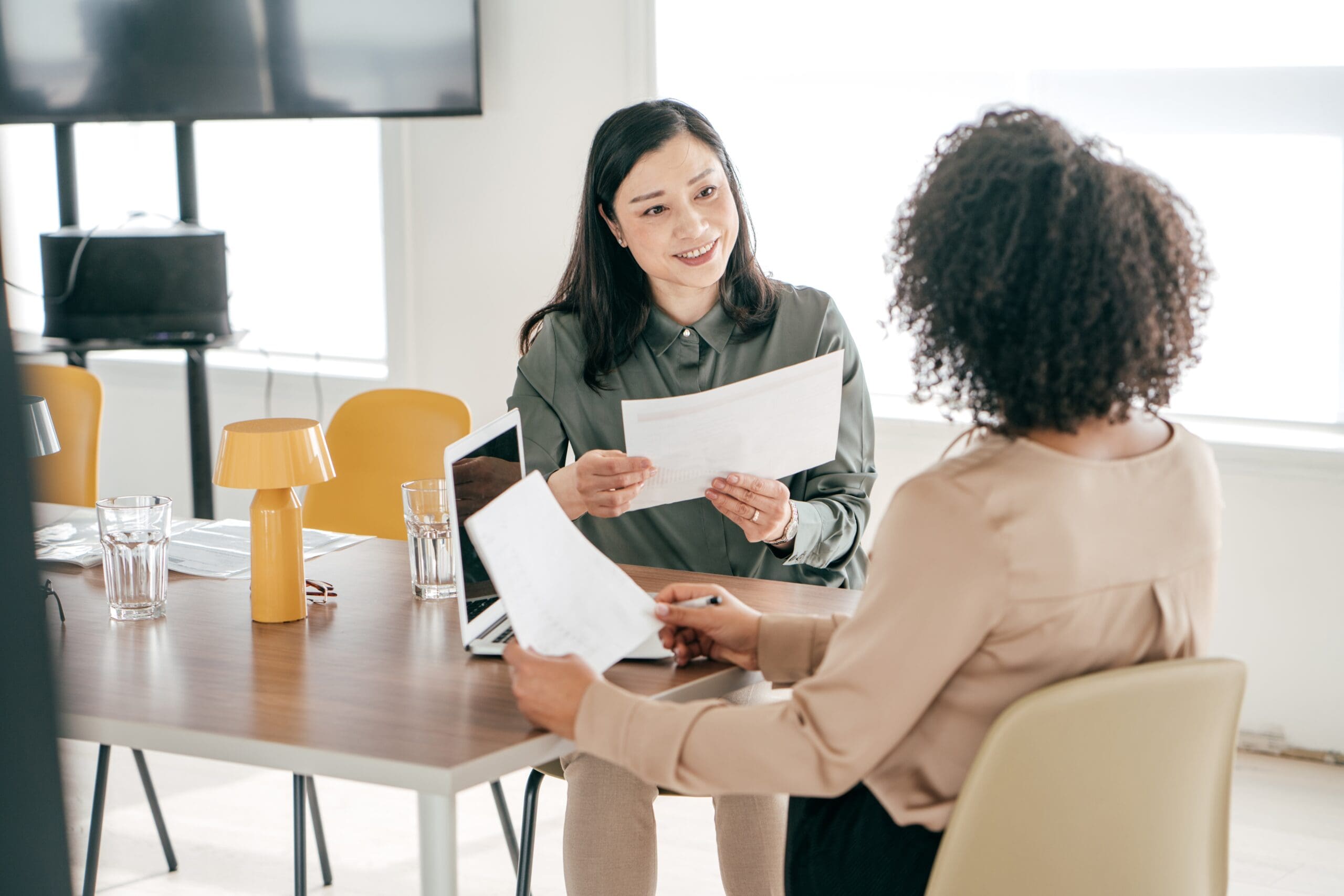 Two women sat together doing an interview scaled