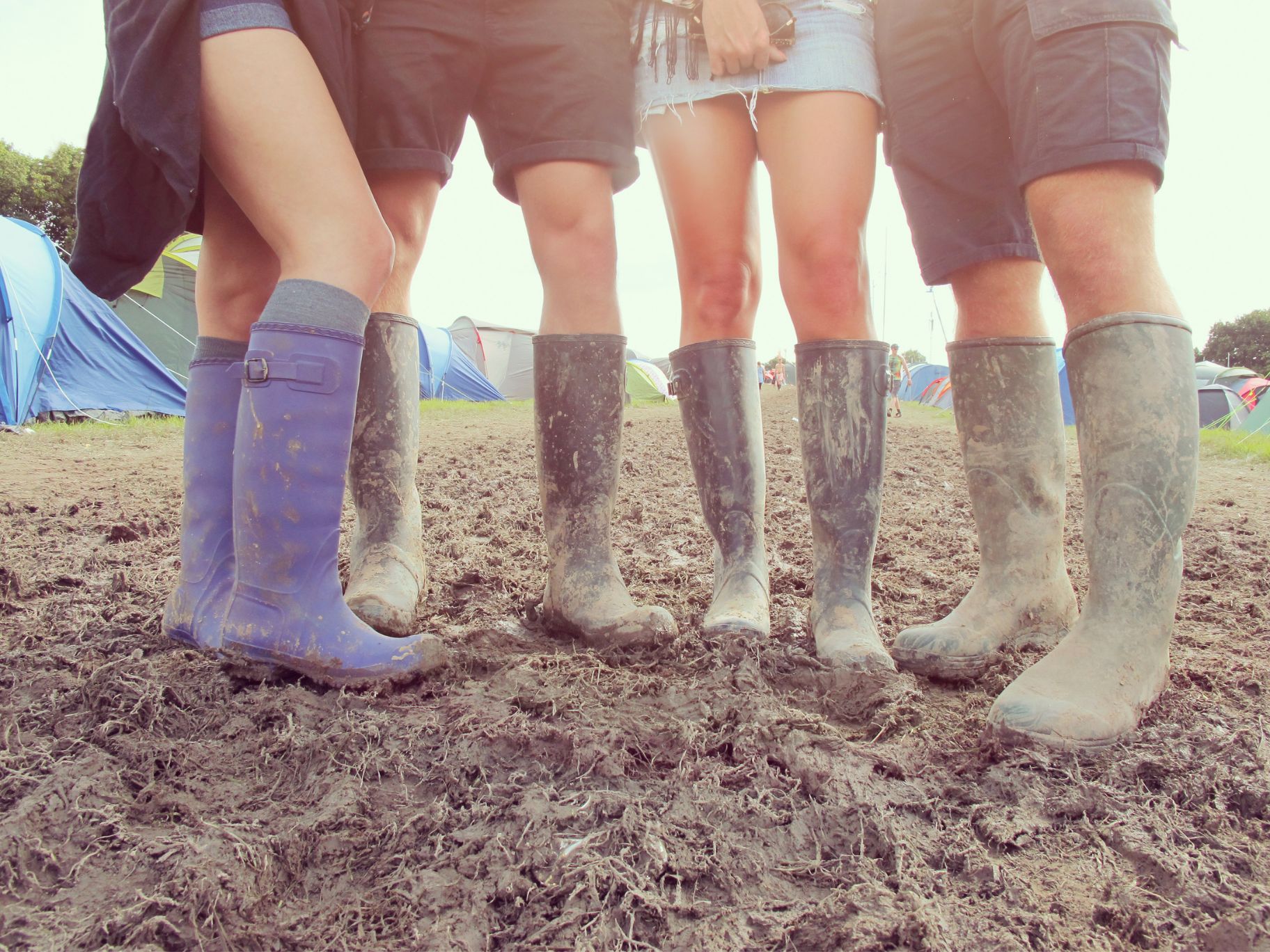 Wearing wellies at music festival