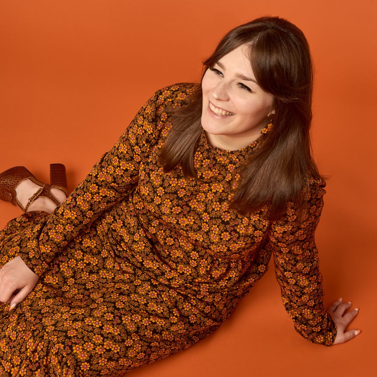 Jodie Richardson sitting on the floor, smiling