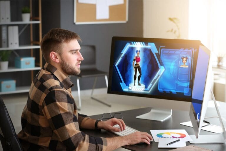 Man designing a character for game on computer