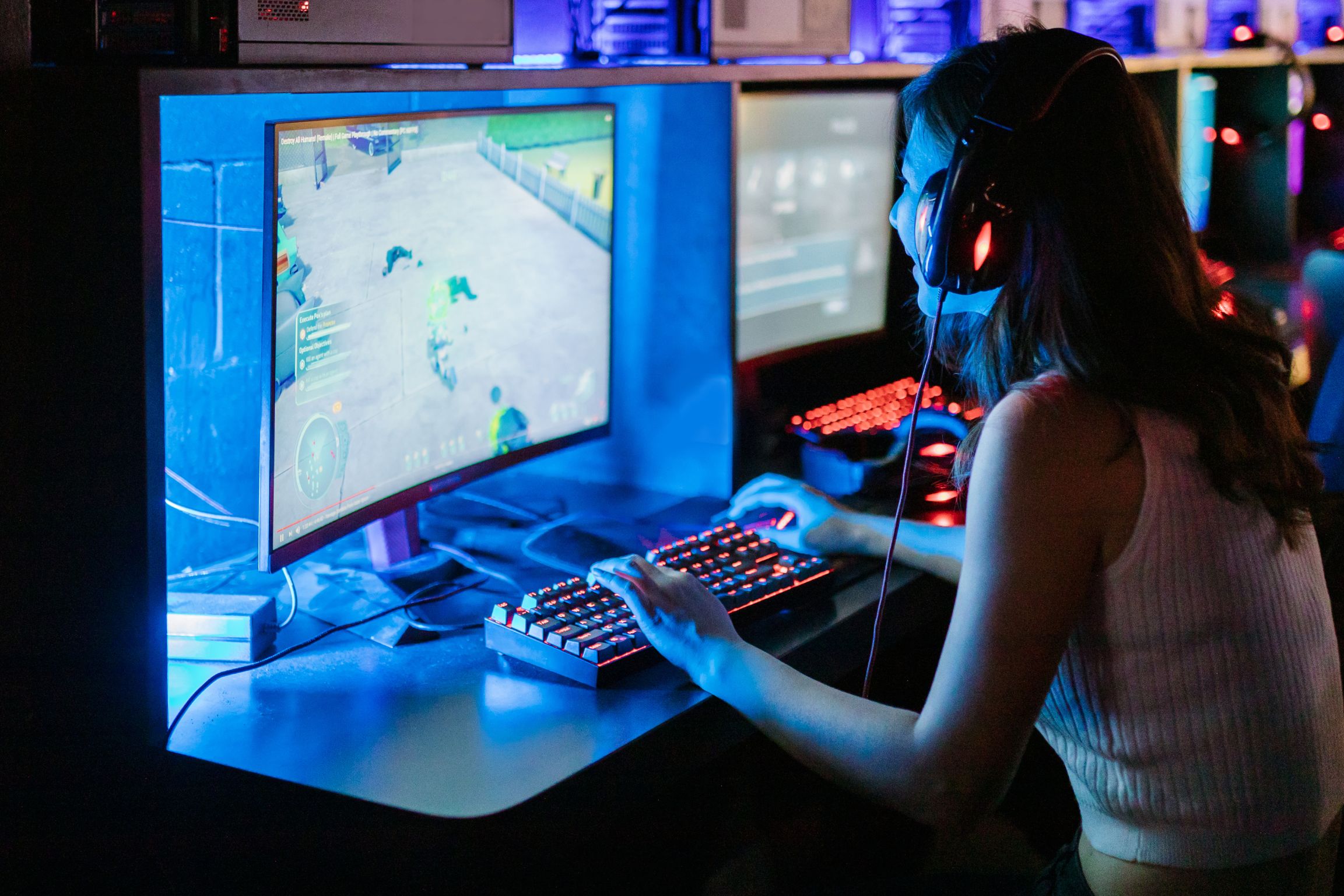 Female playing video games at a venue in London