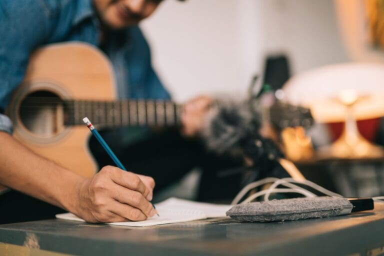 Guitarist writing a song