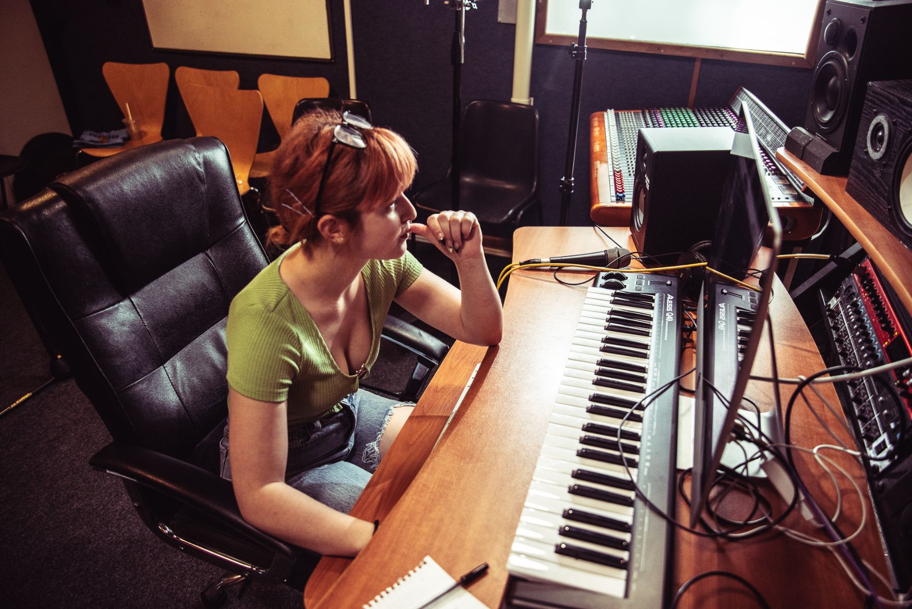 Female ACC student working on sound design hardware