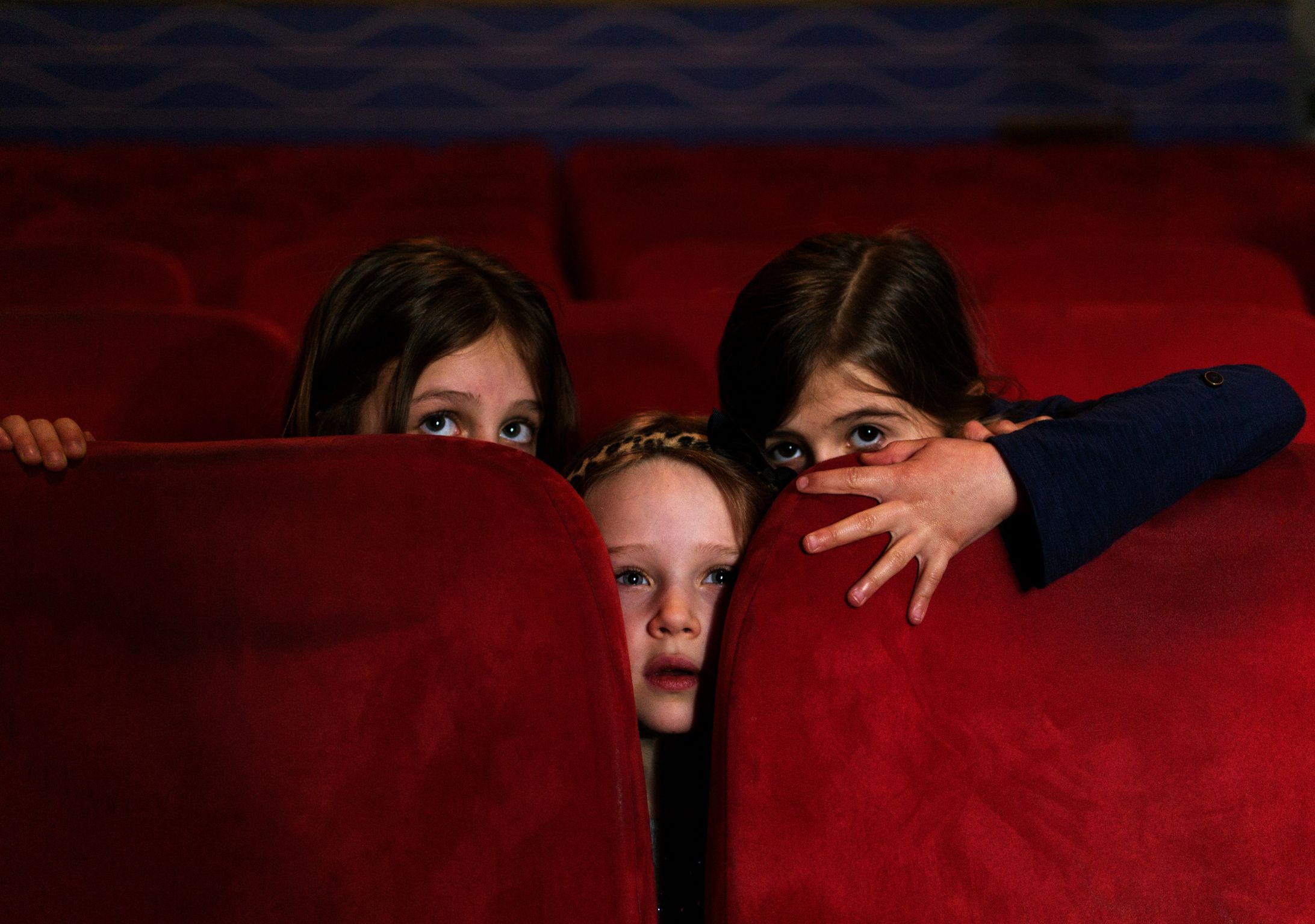 Kids hiding in cinema during scary film