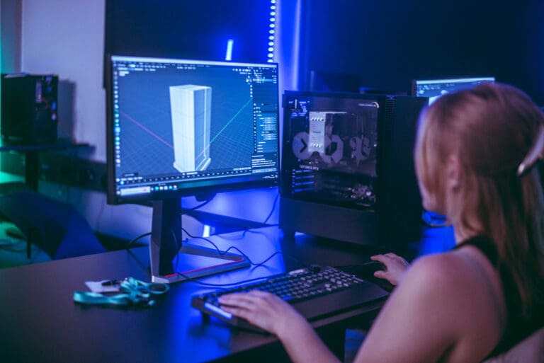 Young female student using 3D Modelling tool on computer