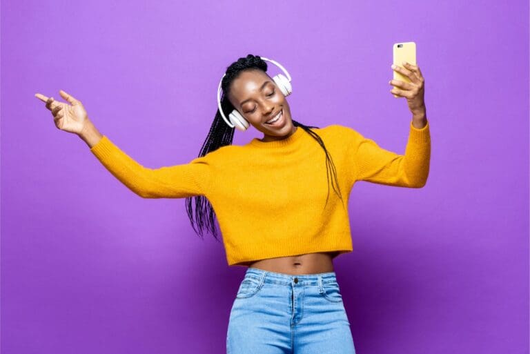 Young woman listening to music on phone