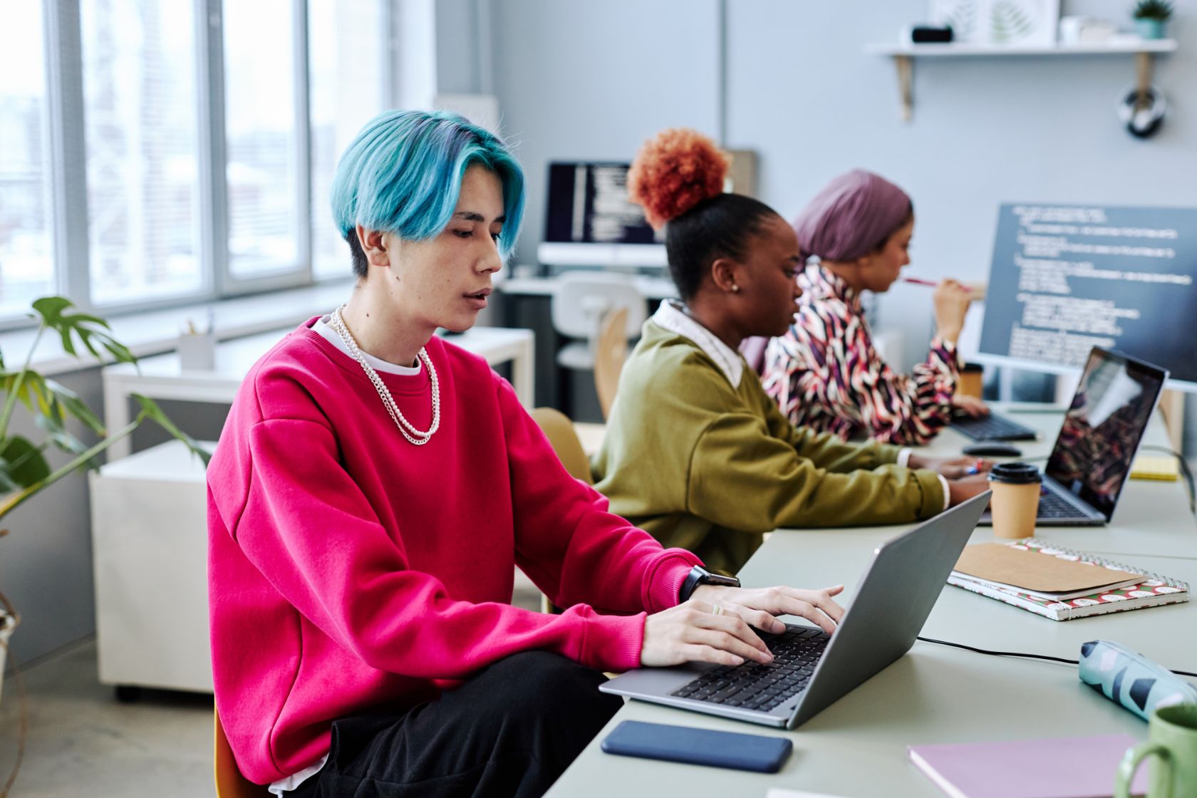 Gen Z young people working on laptops