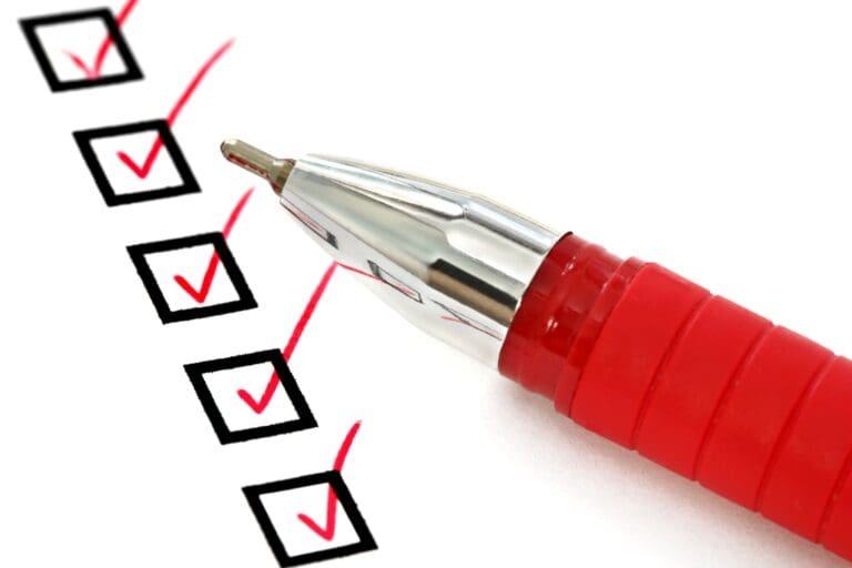 Red pen on checklist